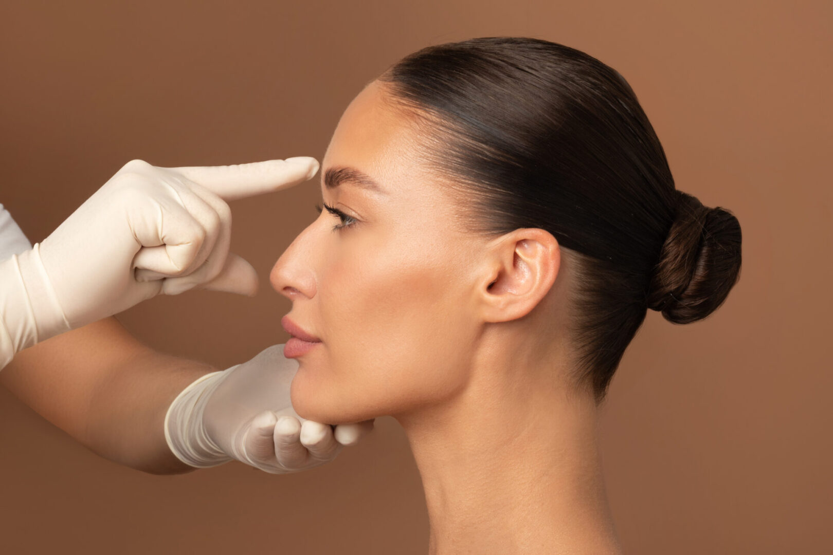 Profile of a woman preparing for a cosmetic procedure.