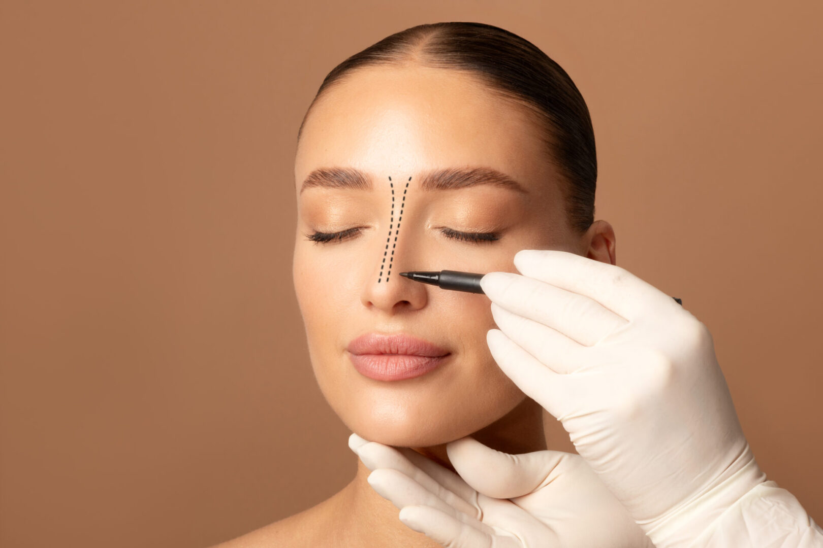 A woman getting a nose measurement for cosmetic treatment.