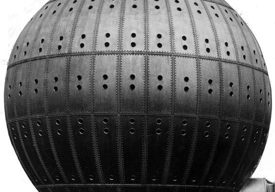 A large spherical building with a perforated metal facade.